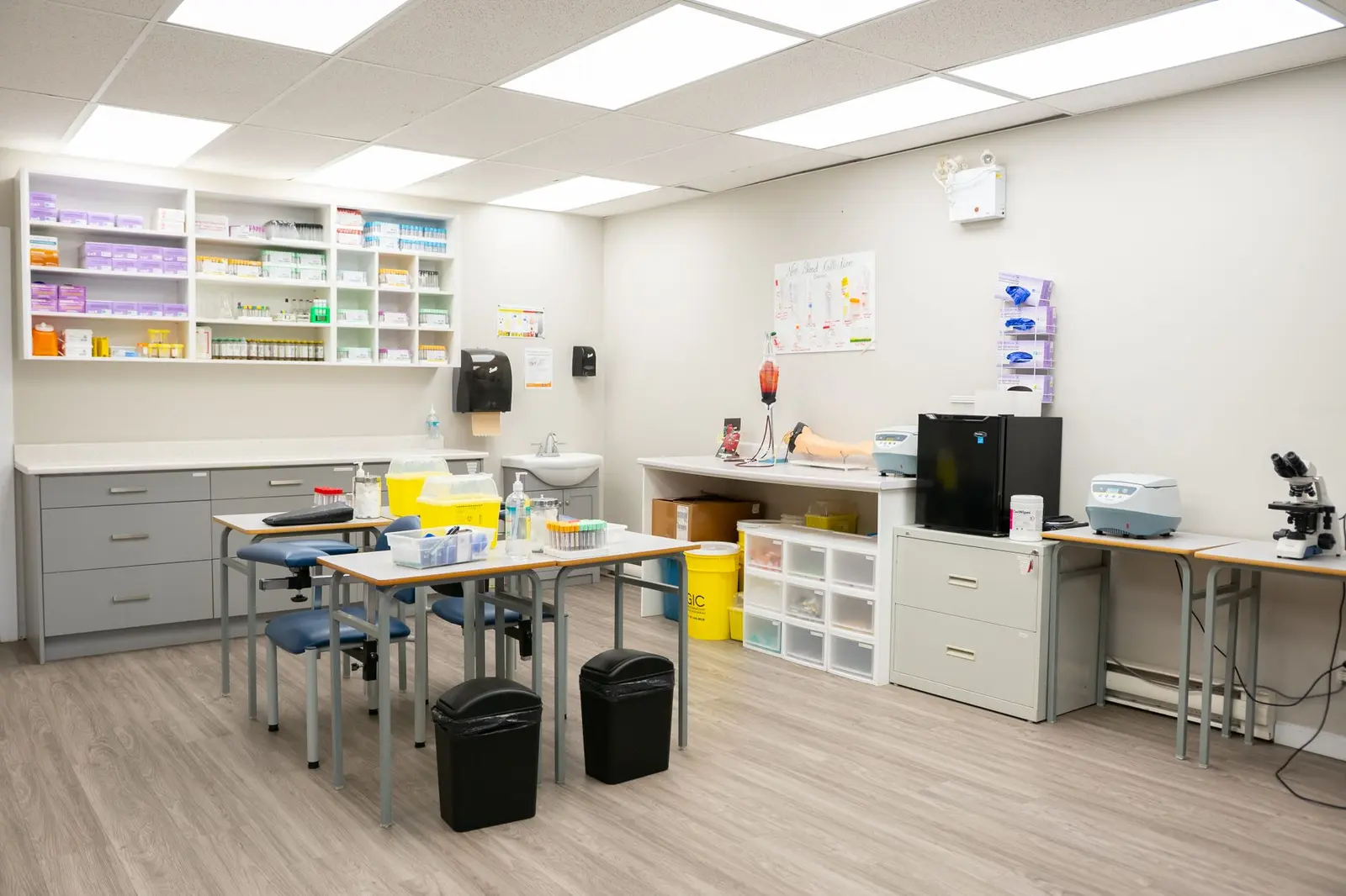 A bright, organized medical office with equipment and storage